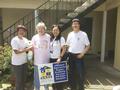 The RSVP volunteers pose with the senior homeowner.