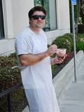 Eric Temple takes a break from serving and helps himself to ice cream.