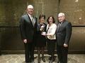 Receiving the Platinum award for Gloabl Achievement - Executive Officer Paul Cardus, Public Affairs & Communications Director Rose Meily, President Denise Welsh and President-elect Bill Moody