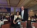 Executive Officer Paul Cardus congratulates Evangeline "Vangie" Yia, recognized as International REALTOR&reg; of the Year.