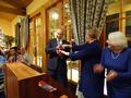 Mary Kay Groth passes the gavel to Ryan Nunnally.