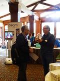Larry Magid in discussion with a member.