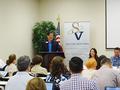 Jimmy Kang poses questions to the panelists.