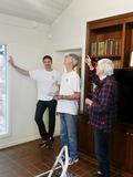 RSVP volunteers and the senior homeowner decide on a smoke detector.