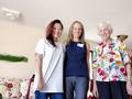 Ella Liang and Ashley Banks with a happy senior homeowner.