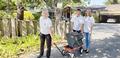 Nancy Goldkamp and other RSVP volunteers move a television for a homeowner.