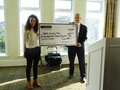 Pelin Erdal accepted the check on behalf of the Family Giving Tree.