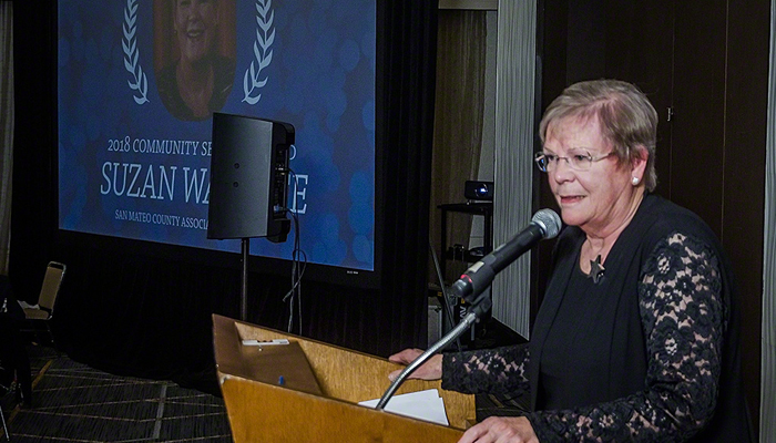 2018 Community Service Award winner Suzan Wallace accepting the award