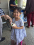 This young lady gets ready to enjoy her ice cream.