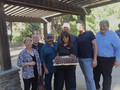 Teri Saldivar holds the birthday cake, pictured with SILVAR board director Joanne Fraser, Past President Bill Moody, President Alan Barbic, EO Paul Cardus, treasurer Jeff Bell, PRDS President Mark Burns