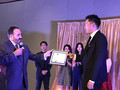 President Alan Barbic presents Yuan Chang with a congratulatory certificate from SILVAR.