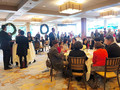 Members celebrated the holidays after the serious panel discussion.