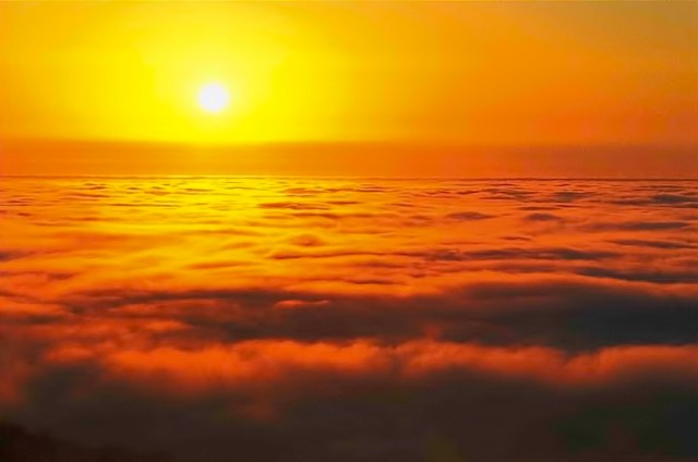 Sun's halo, molten glow, sea of fog, Big Sur, California