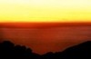Yellow sky, bronze-red Pacific, Big Sur, California