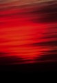 Dynamite-red twilight over a coal-black sea, Big Sur, California
