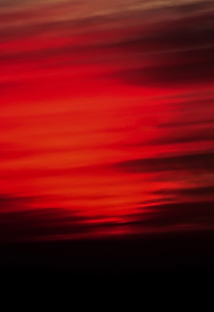 Dynamite-red twilight over a coal-black sea, Big Sur, California