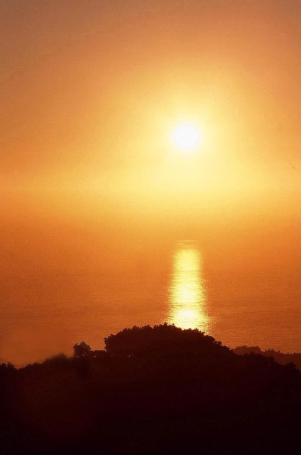 Starburst setting sun (#2, vertical), Big Sur, California