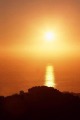 Starburst setting sun (#2, vertical), Big Sur, California