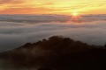 Sunburst settles into clouds, Big Sur, California