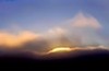 Cloud glows gold, Big Sur, California