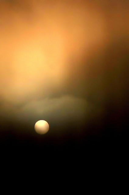 Cyclops-sun in storm clouds (#3, vertical)... Big Sur, California