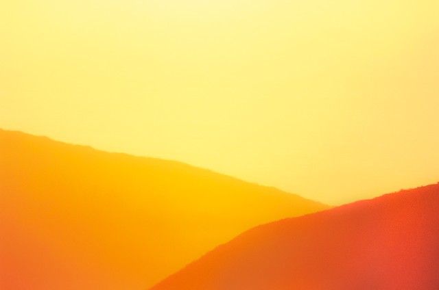 Yellow sea behind ridges, Big Sur, California