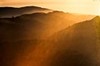 Mist shimmers in setting sun (#1)... Big Sur, California
