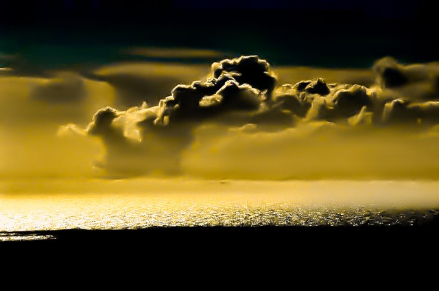 Forest-fire clouds over gold sea, Big Sur, California
