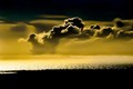 Forest-fire clouds over gold sea, Big Sur, California