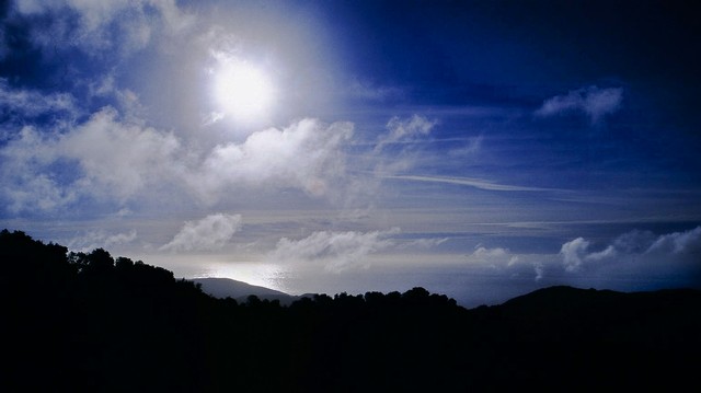 Sun and dispersing clouds, Big Sur, California