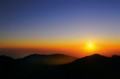 Sun sinks into lava sea, Big Sur, California