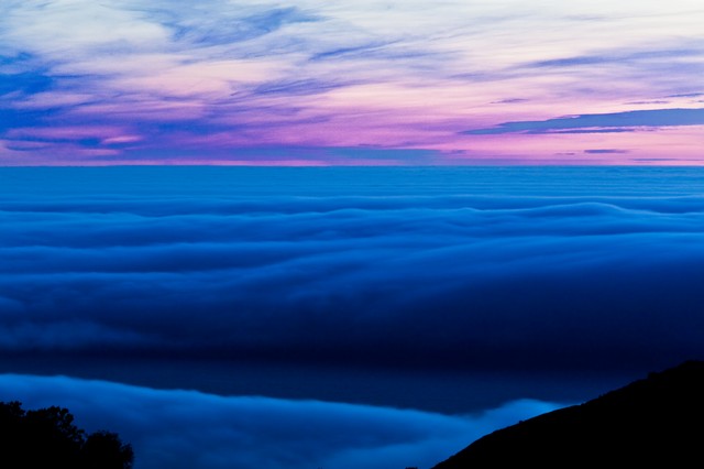 Pink clouds over blue fog, Big Sur, California