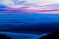 Pink clouds over blue fog, Big Sur, California