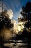 Sun setting behind Castle Geyser (color, #1), Yellowstone National Park, Wyoming