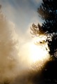 Sun setting behind Castle Geyser (color, #3), Yellowstone National Park, Wyoming