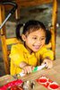 Child Playing in Mountainside Cafe
