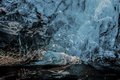 Explorers in Ice Cave in Vatnajökull National Park Glacier (#1, color, horizontal)