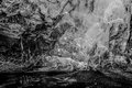 Explorers in Ice Cave in Vatnajökull National Park Glacier (#2, black and white, horizontal)