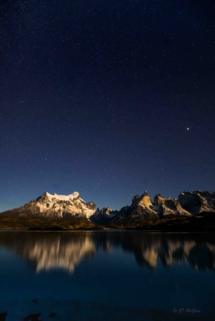 Night sky over Pehoe Lago, Paine Grande and Cuernos del Paine