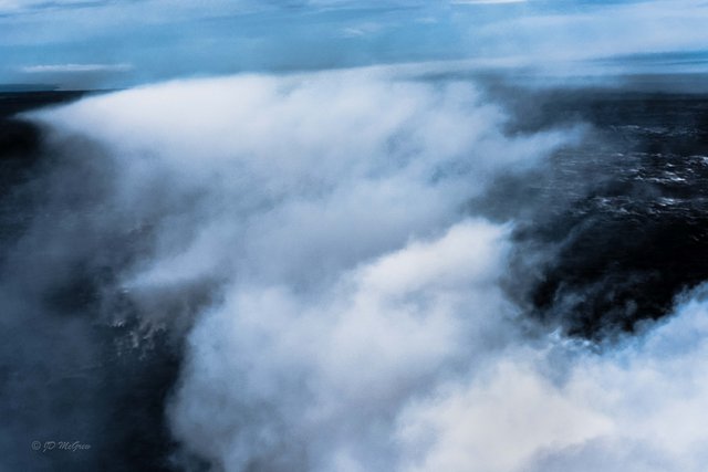 Clouds of Smoke Rise from Lava Flowing into the Sea, from Helicopter, #1