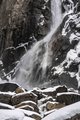 Yosemite Waterfall Crashing Onto Snow Covered Boulders #1, vertical