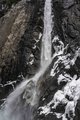 Yosemite Waterfall Crashing Onto Snow Covered Boulders #2, vertical