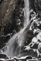 Yosemite Waterfall Crashing Onto Snow Covered Boulders #3, vertical