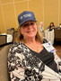 Katherine Frey tries on the REALTORS&reg; cap.