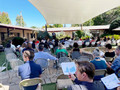 An estimated 70 members gather at Little House Activity Center in Menlo Park to hear Jeffrey Traum speak.