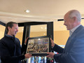 SILVAR Executive Officer Paul Cardus presents Brett Caviness with a token to remember his year at SILVAR, a photo collage