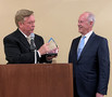 Jim Hamilton presents SILVAR CEO Paul Cardus with his own special gift.