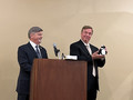 2002 California Association of REALTORS&reg; President Robert Bailey presents Jim Hamilton with a gag gift.