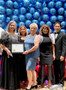 SILVAR 2021 president & C.A.R.Region 9 Chair Joanne Fraser presents 2023-2024 FAREPA President Anne Orozco-Ramirez a congratulations certificate from SILVAR as the leadership team looks on.