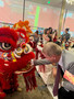 Jeff Bell greets the Chinese dragon.